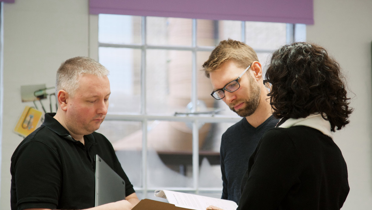 Mark in discussion with colleagues