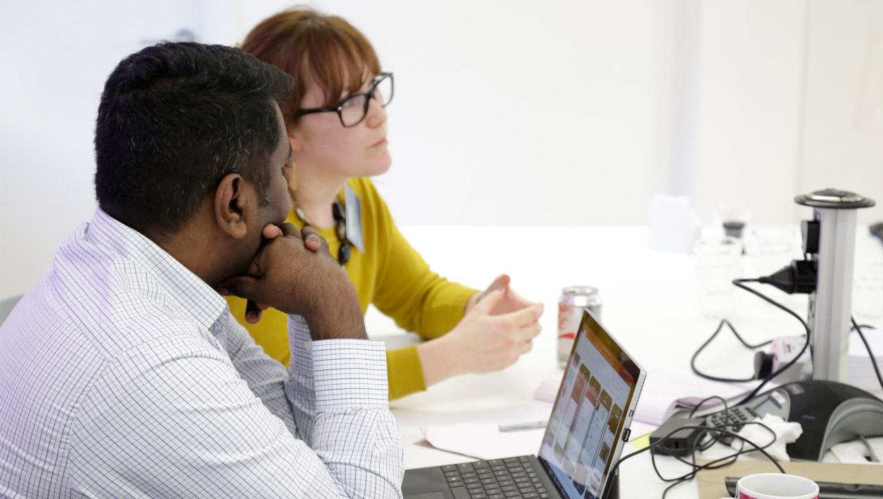 Team members in deep discussion