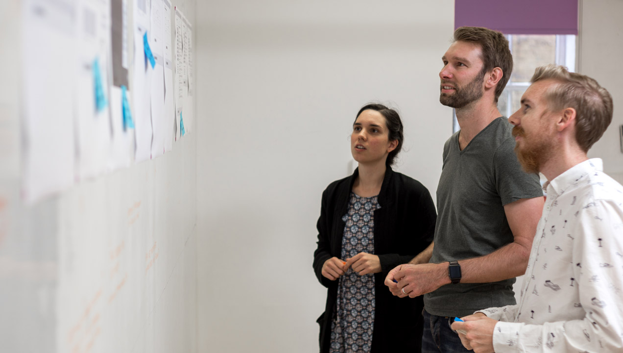 Members of our team planning and discussing findings