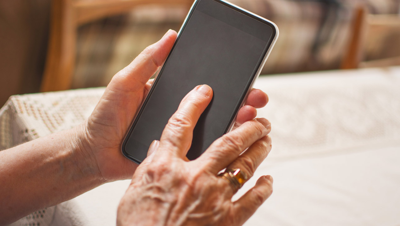 An older lady using a smartphone