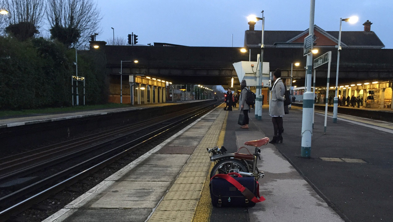 Anton waiting at the station with his Brompton