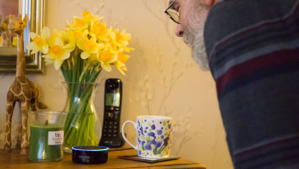 Man speaking to an Amazon Echo