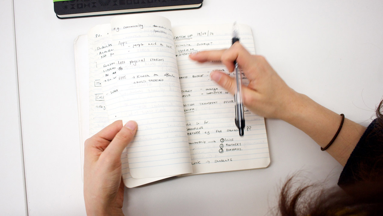 Woman writing in notebook