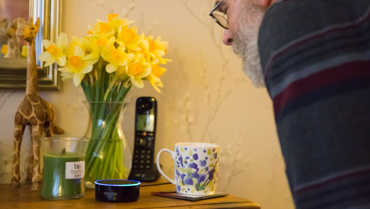 A man speaking to a voice device