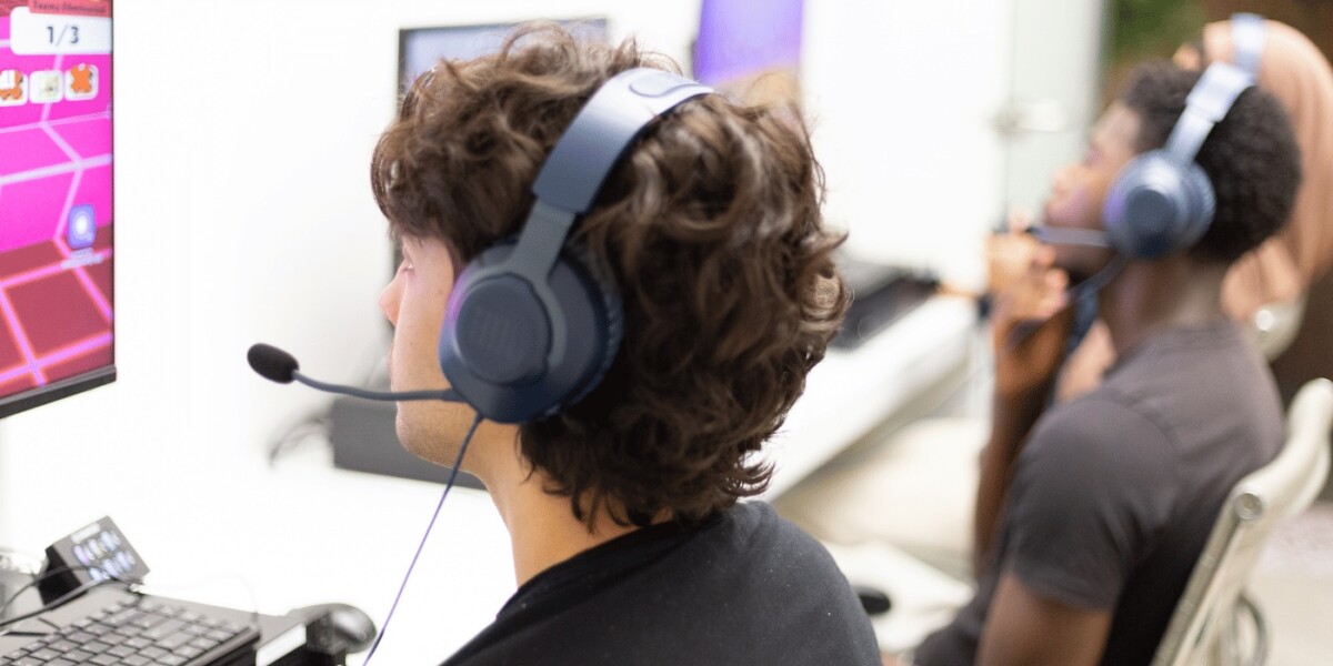 Young man playtesting wearing headset