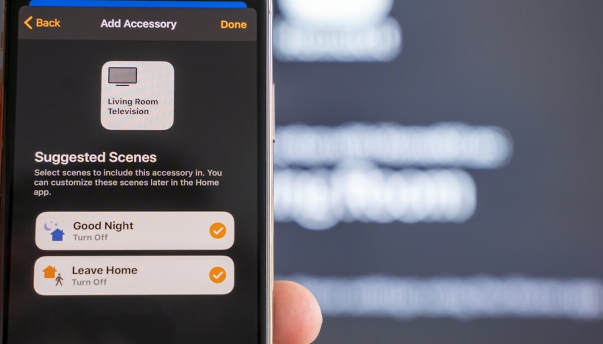 Hand holding a smart home app